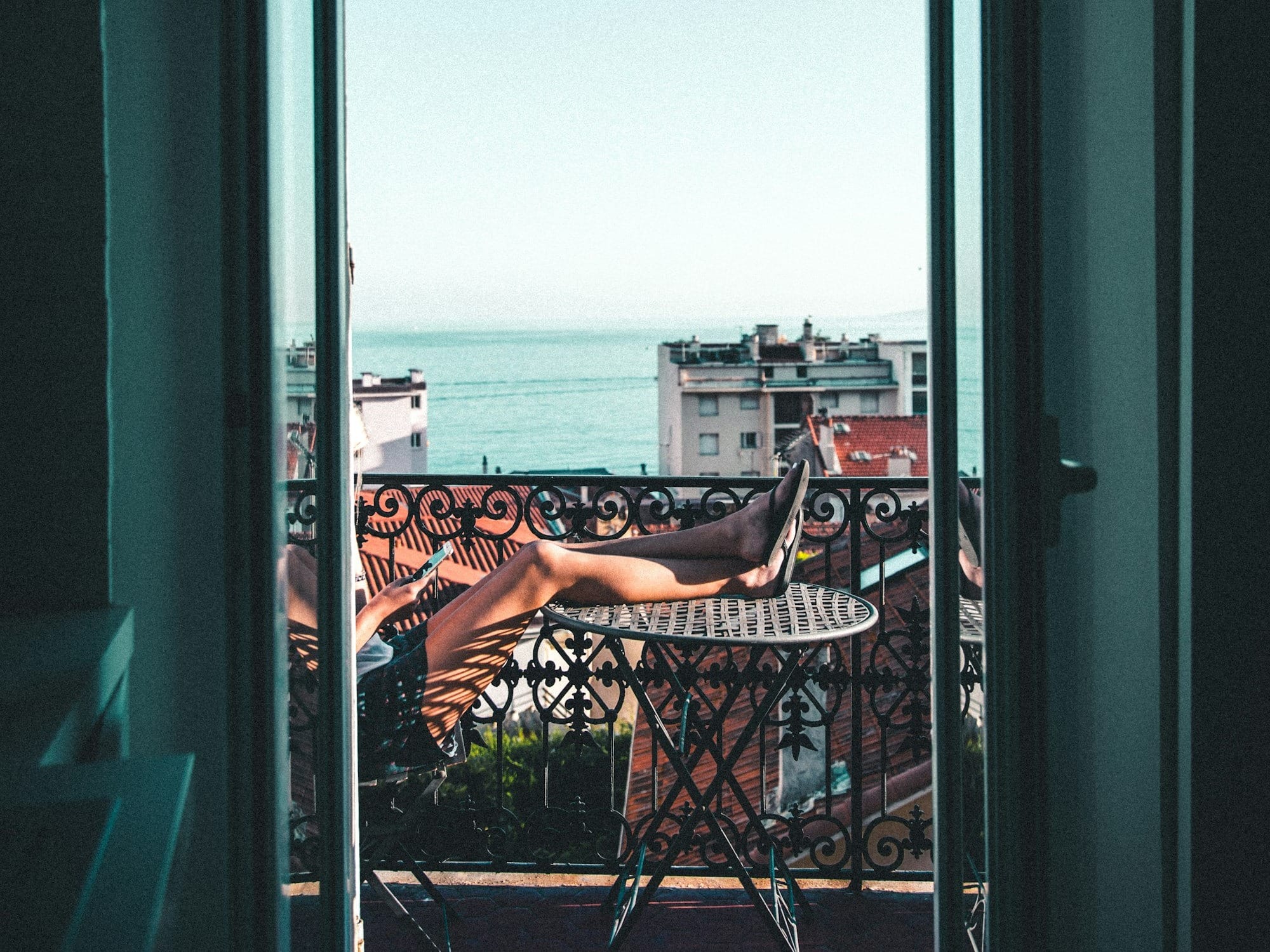 person sitting on balcony